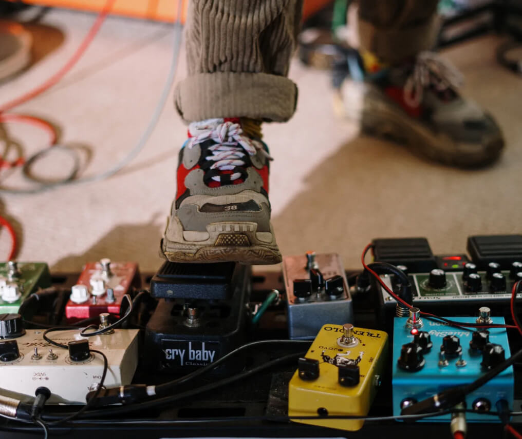 A persons foot stepping on music pedal